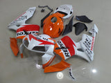 White and Orange Repsol Fairing Kit for a 2005 and 2006 Honda CBR600RR motorcycle