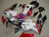 White, Red, Black and Blue Domino Fairing Kit for a 2003, 2004 Honda CBR600RR motorcycle.