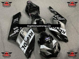Silver, Black and White Repsol Fairing Kit for a 2004 and 2005 Honda CBR1000RR motorcycle