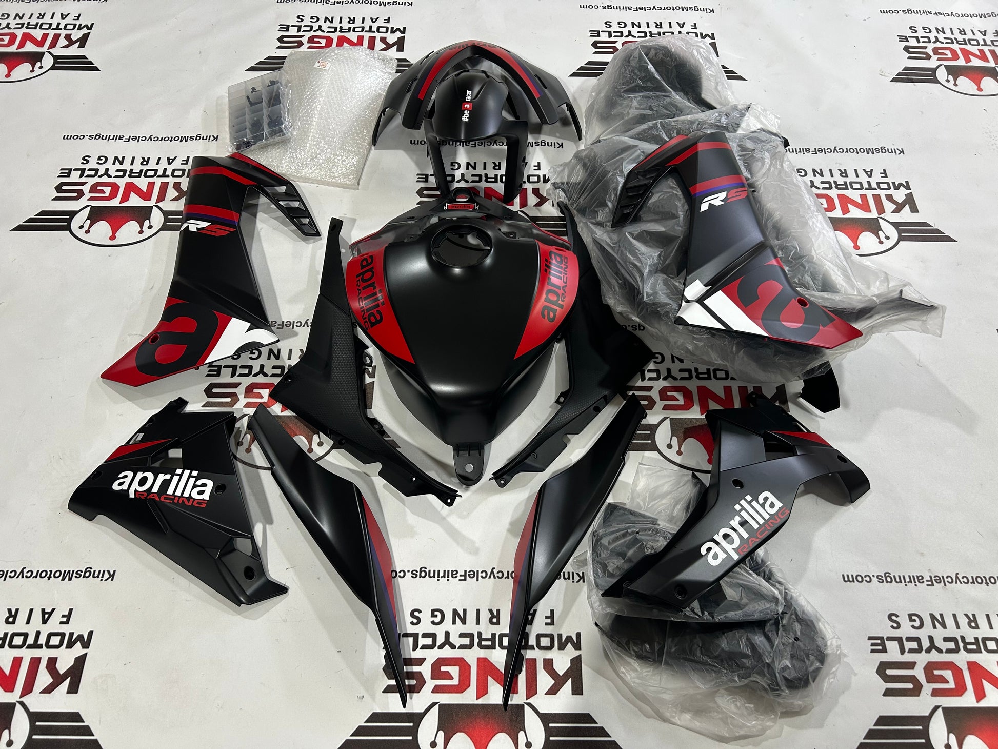 Aprilia RS457 Fairings (2024-2025) Matte Black, Matte Red at KingsMotorcycleFairings.com