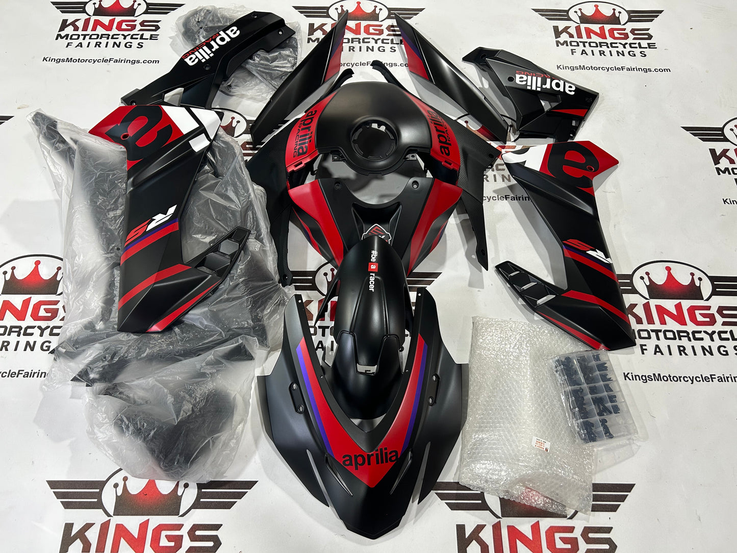 Aprilia RS457 Fairings (2024-2025) Matte Black, Matte Red from KingsMotorcycleFairings.com