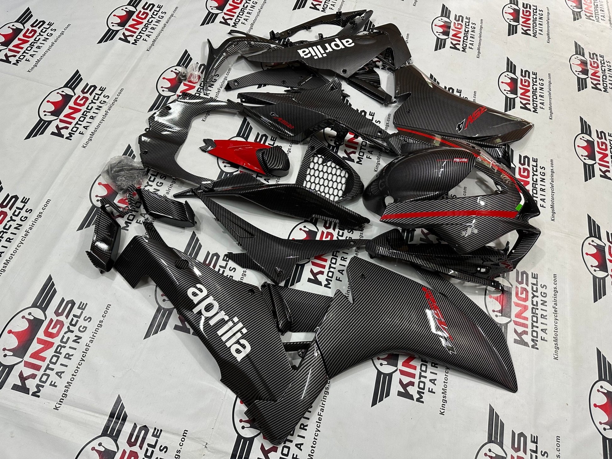 Aprilia RSV4 1000 Fairings (2009-2015) Faux Carbon Fiber, Red, White from KingsMotorcycleFairings.com