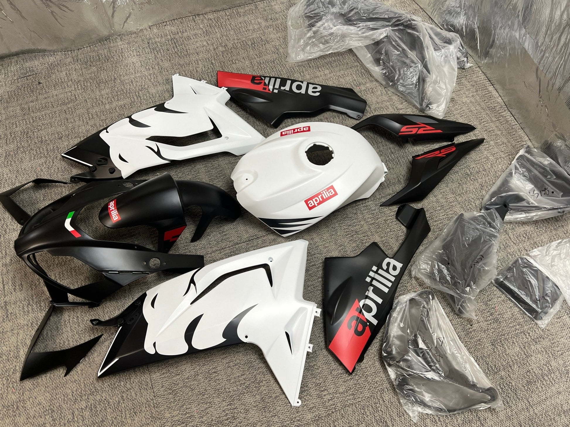 Aprilia RSV4 1100 Fairing Set (2021-2024) Matte Black, White Lion at KingsMotorcycleFairings.com