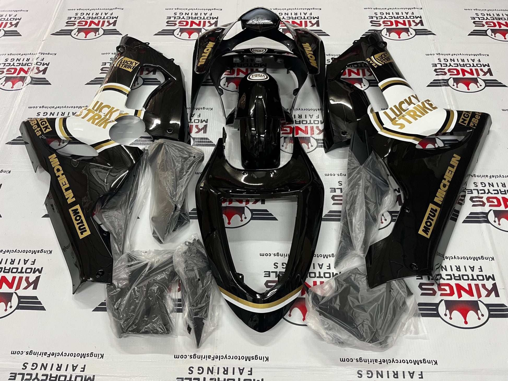Fairing kit for a Kawasaki ZX6R 636 (2005-2006) Black, Gold & White Lucky Strike at KingsMotorcycleFairings.com