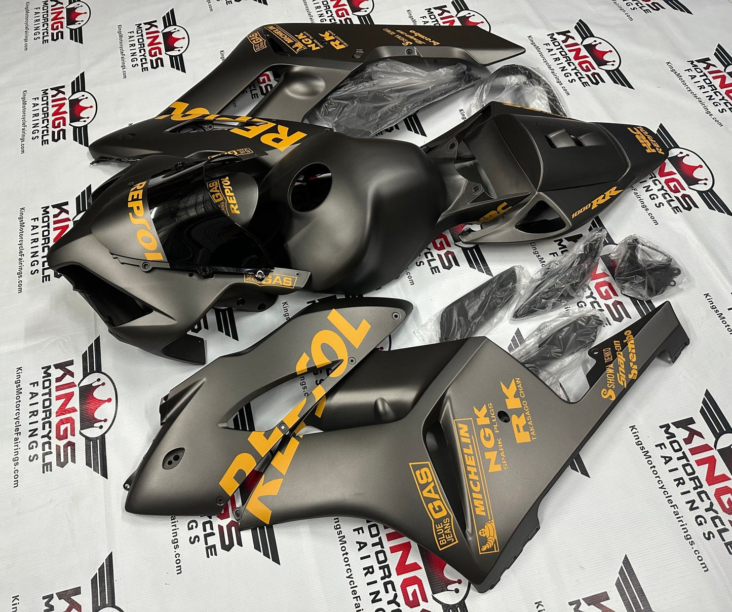 Honda CBR 1000RR Fairings (2004-2005) Matte Black, Light Orange Repsol at KingsMotorcycleFairings.com