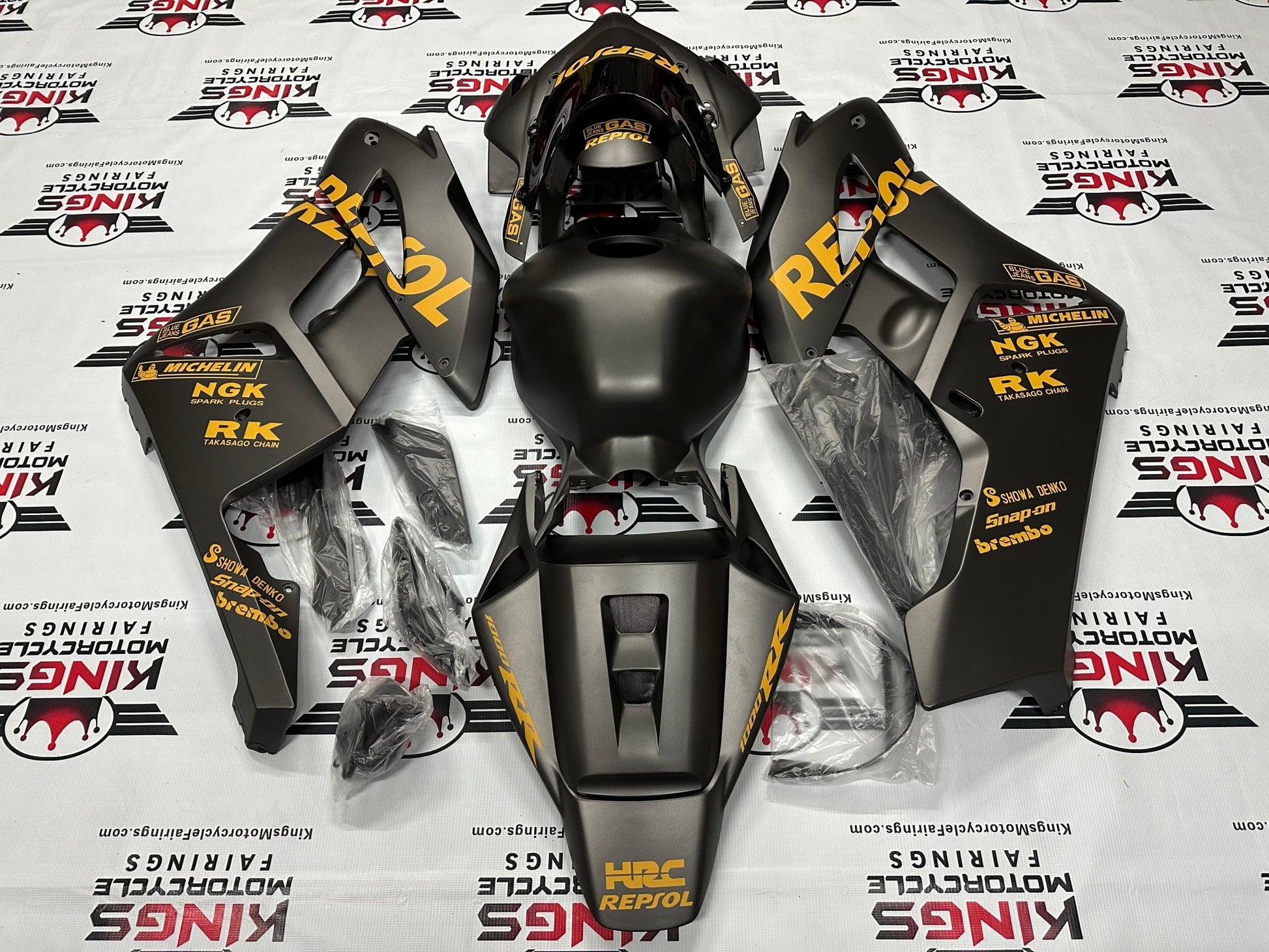 Honda CBR1000RR Fairings (2004-2005) Matte Black, Light Orange Repsol at KingsMotorcycleFairings.com