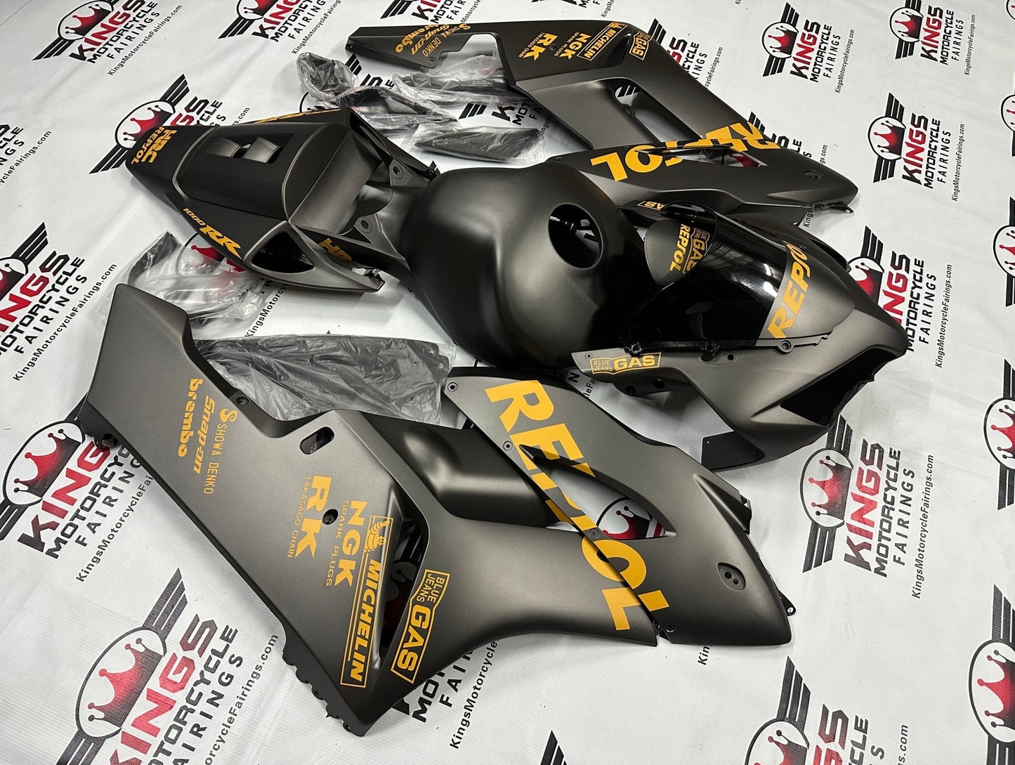 Honda CBR 1000RR Fairings (2004-2005) Matte Black, Light Orange Repsol at KingsMotorcycleFairings.com