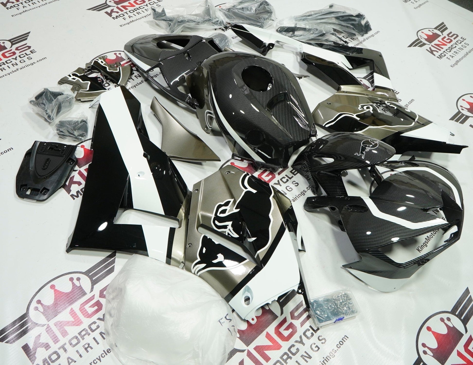 Honda CBR600RR Fairings (2026 Faux Carbon Fiber, Black, Metallic Taupe, White Bull from KingsMotorcycleFairings.com
