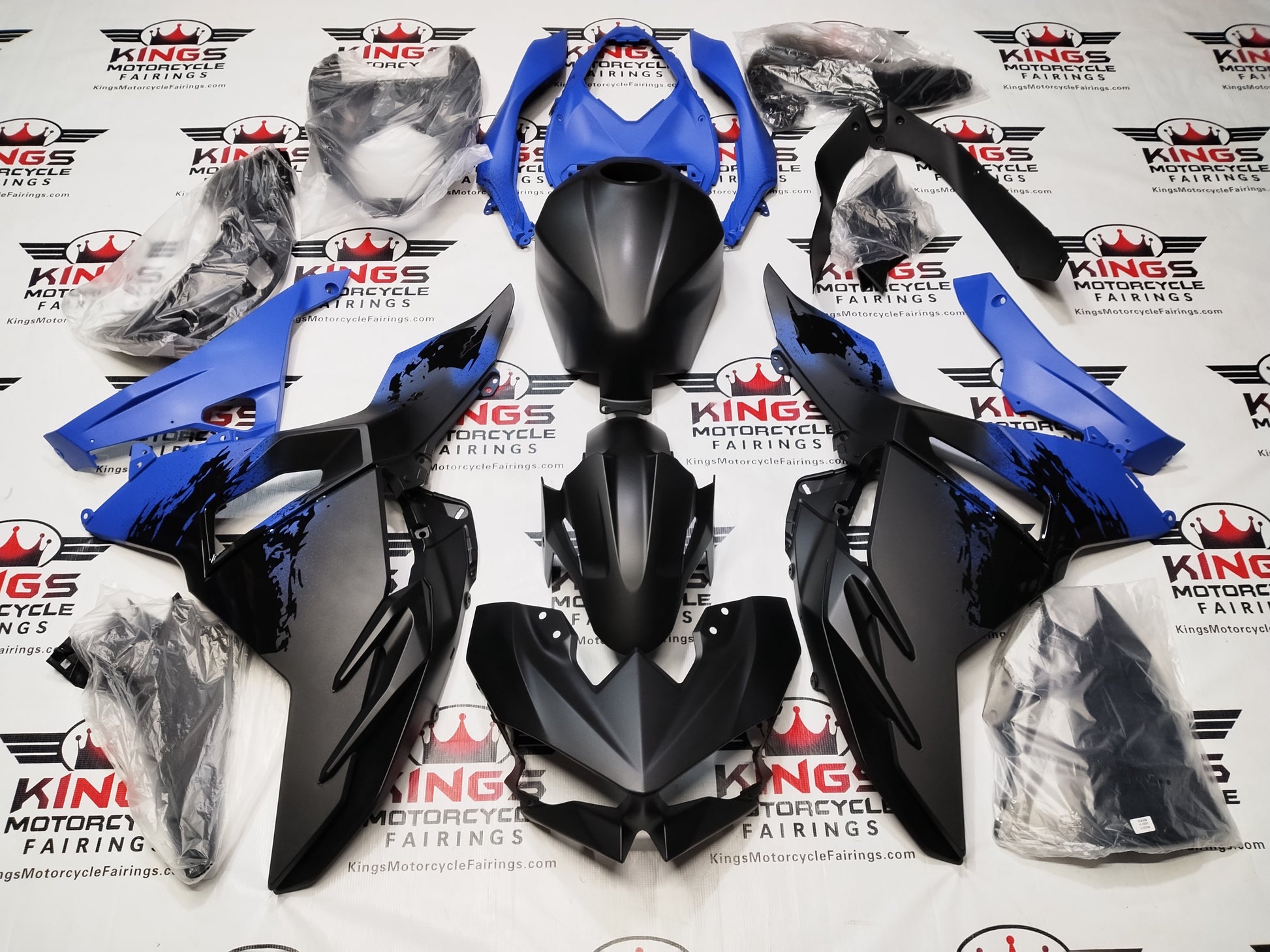 Kawasaki Ninja 500 Fairing Kit (2024-2025) Flat Black, Blue Spray from KingsMotorcycleFairings.com