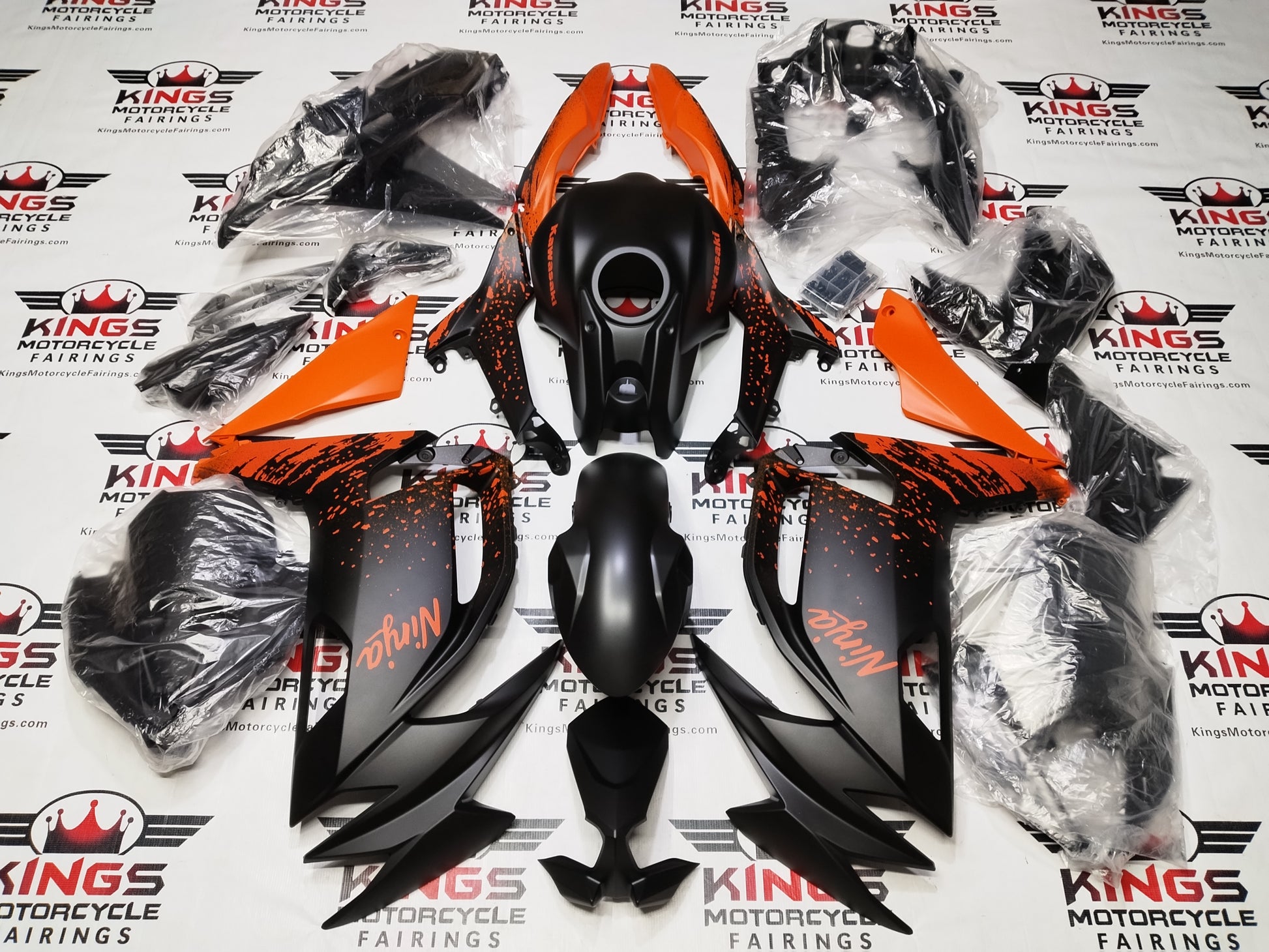 Kawasaki Ninja 500 Fairing Kit (2024-2025) Matte Black, Matte Orange Splash at KingsMotorcycleFairings.com.