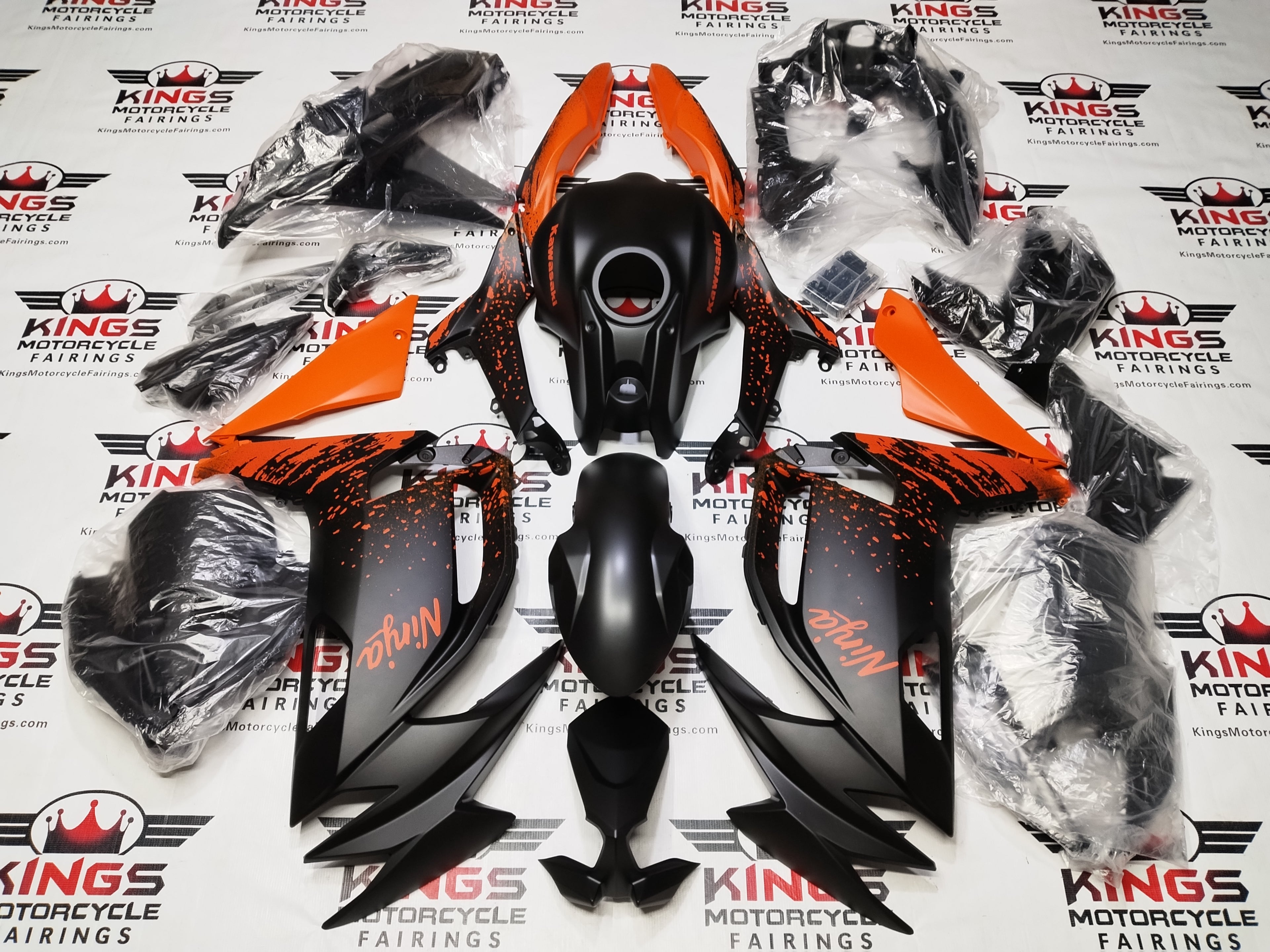 Kawasaki Ninja 500 Fairing Kit (2024-2025) Matte Black, Matte Orange Splash at KingsMotorcycleFairings.com.