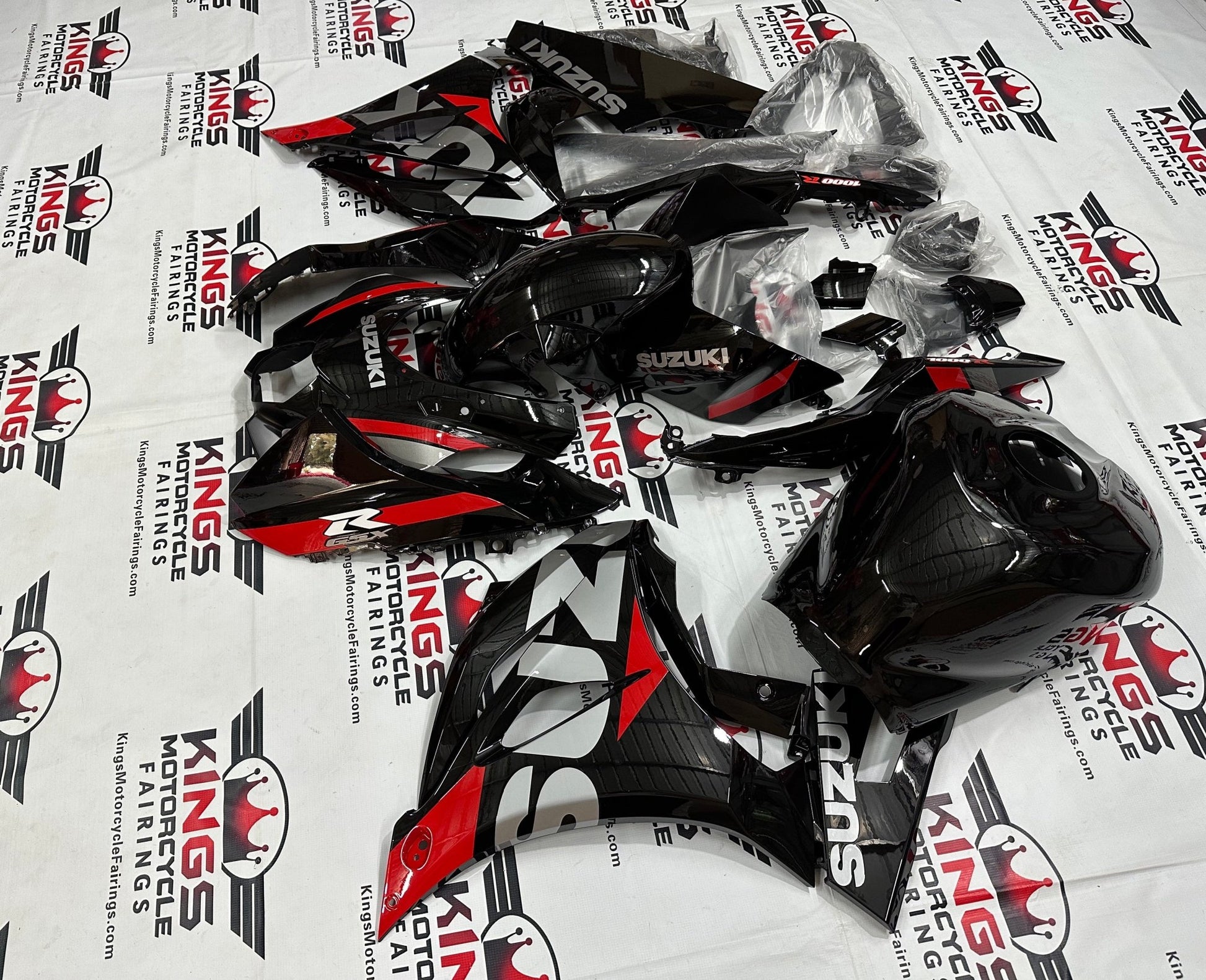 Suzuki GSX-R1000 Fairings (2017-2025) Black, Silver, Red Stripe from KingsMotorcycleFairings.com