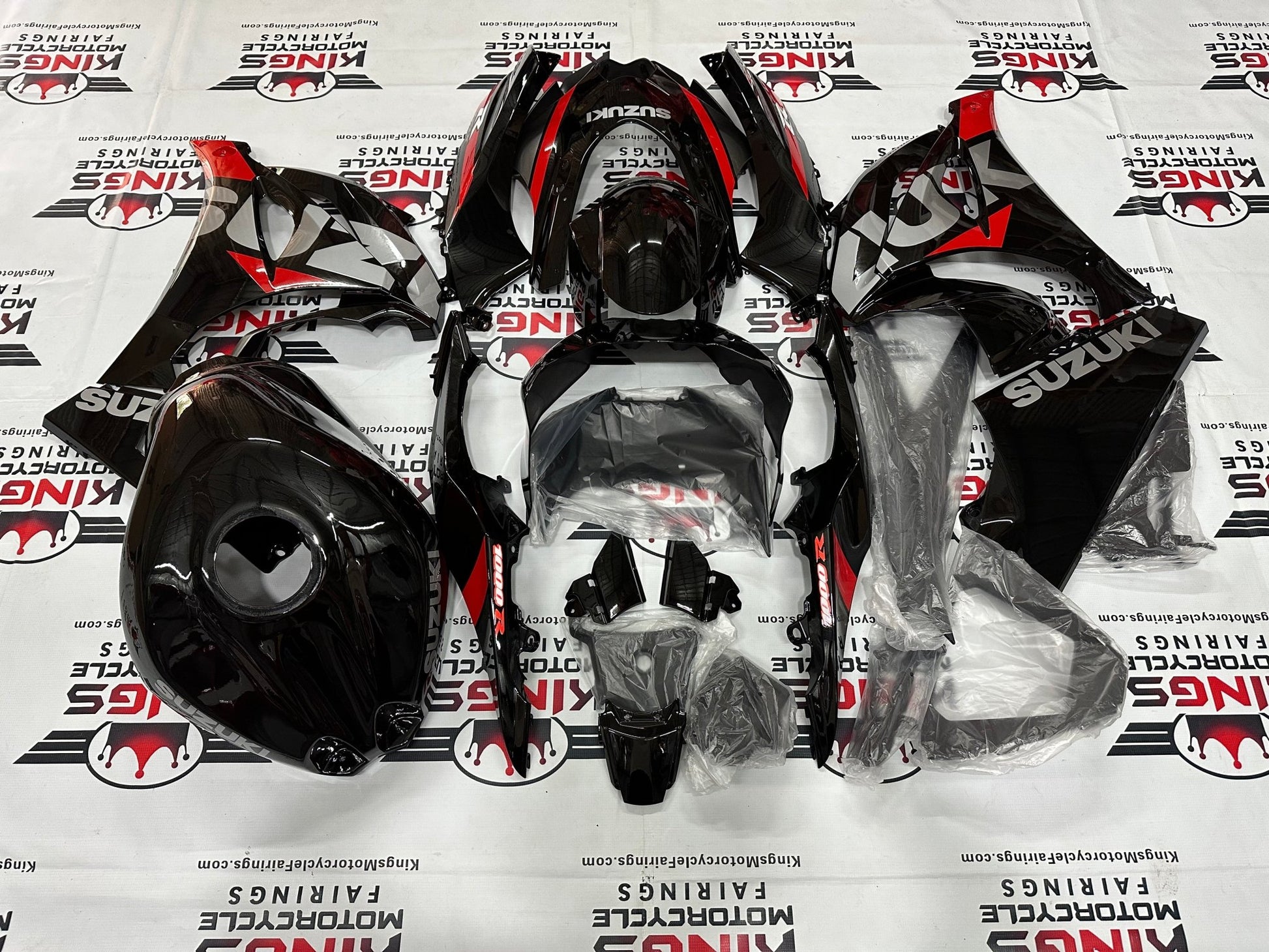 Suzuki GSXR1000 Fairings (2017-2025) Black, Silver, Red Stripe from KingsMotorcycleFairings.com