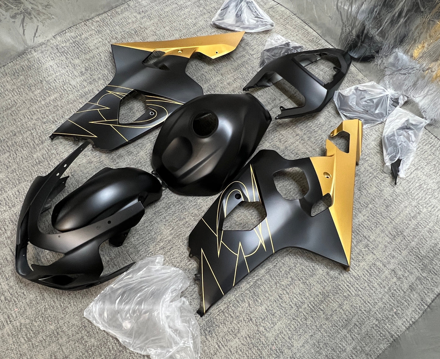 Suzuki GSXR600 Fairing Kit (2004-2005) Flat Black, Gold Tribal from KingsMotorcycleFairings.com