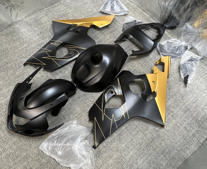 Suzuki GSXR600 Fairing Kit (2004-2005) Flat Black, Gold Tribal from KingsMotorcycleFairings.com