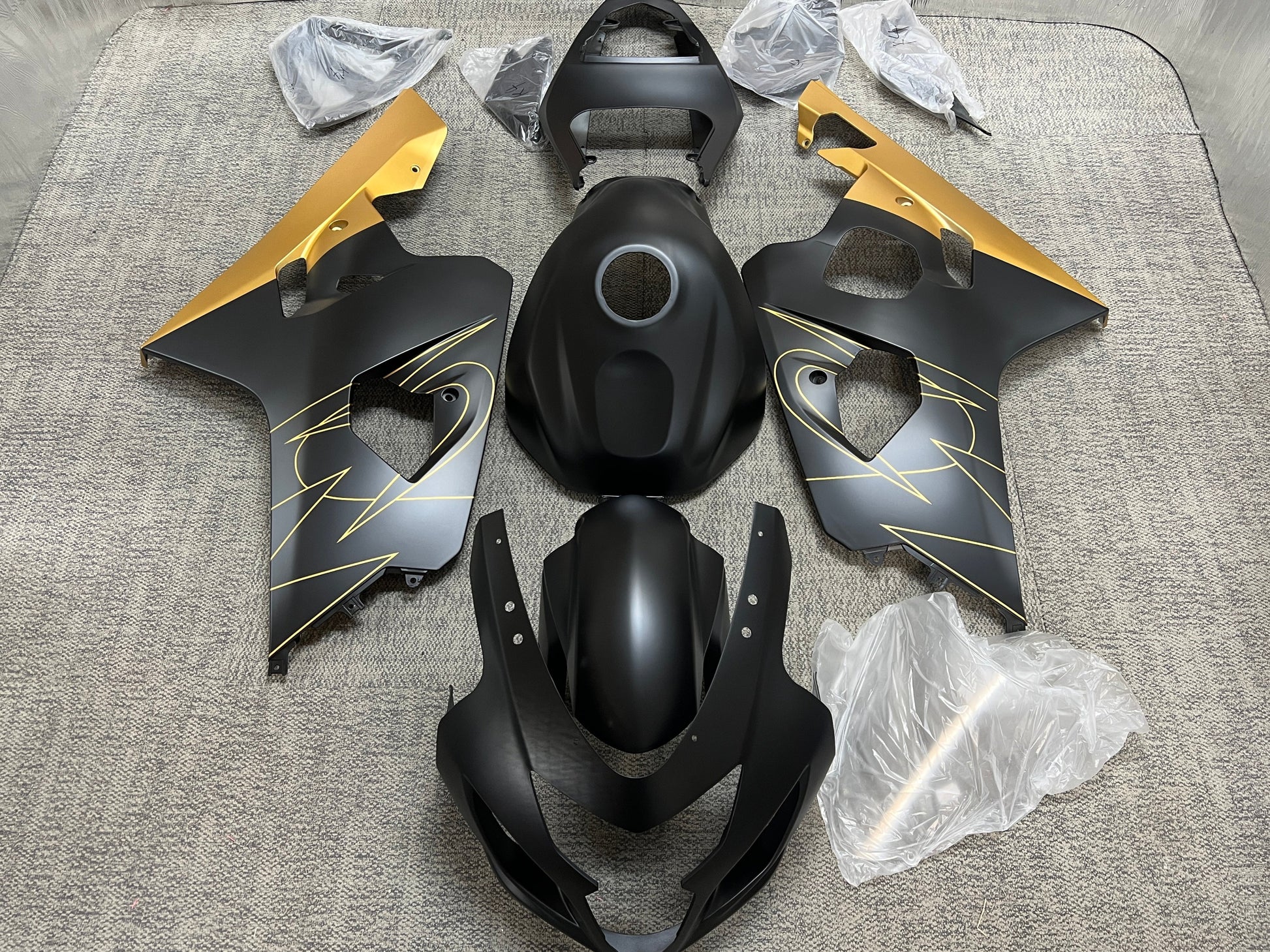 Suzuki GSXR600 Fairing Set (2004-2005) Flat Black, Gold Tribal from KingsMotorcycleFairings.com