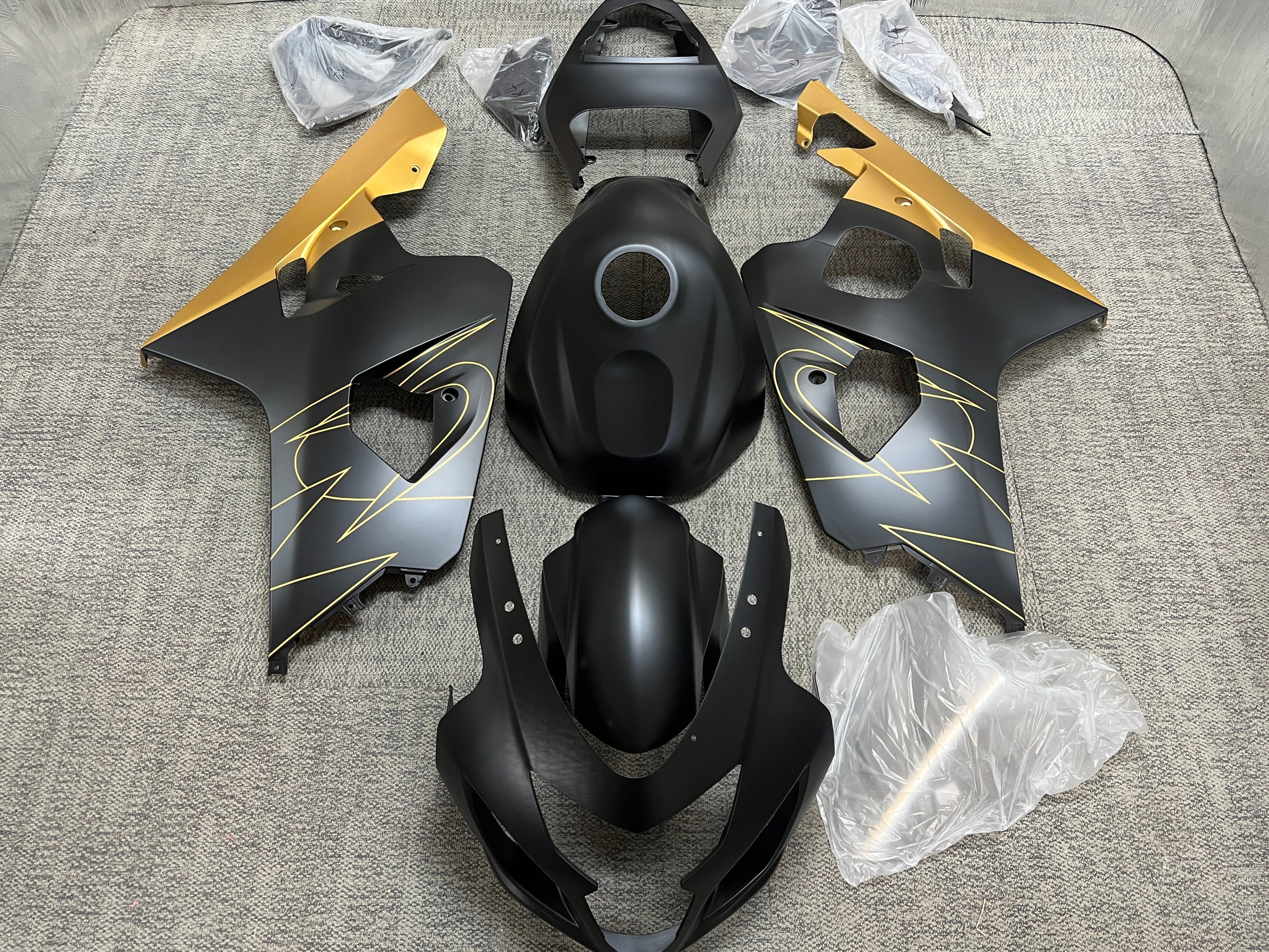 Suzuki GSXR600 Fairing Set (2004-2005) Flat Black, Gold Tribal from KingsMotorcycleFairings.com