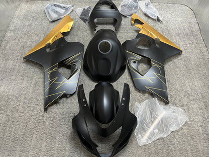 Suzuki GSXR600 Fairing Set (2004-2005) Flat Black, Gold Tribal from KingsMotorcycleFairings.com