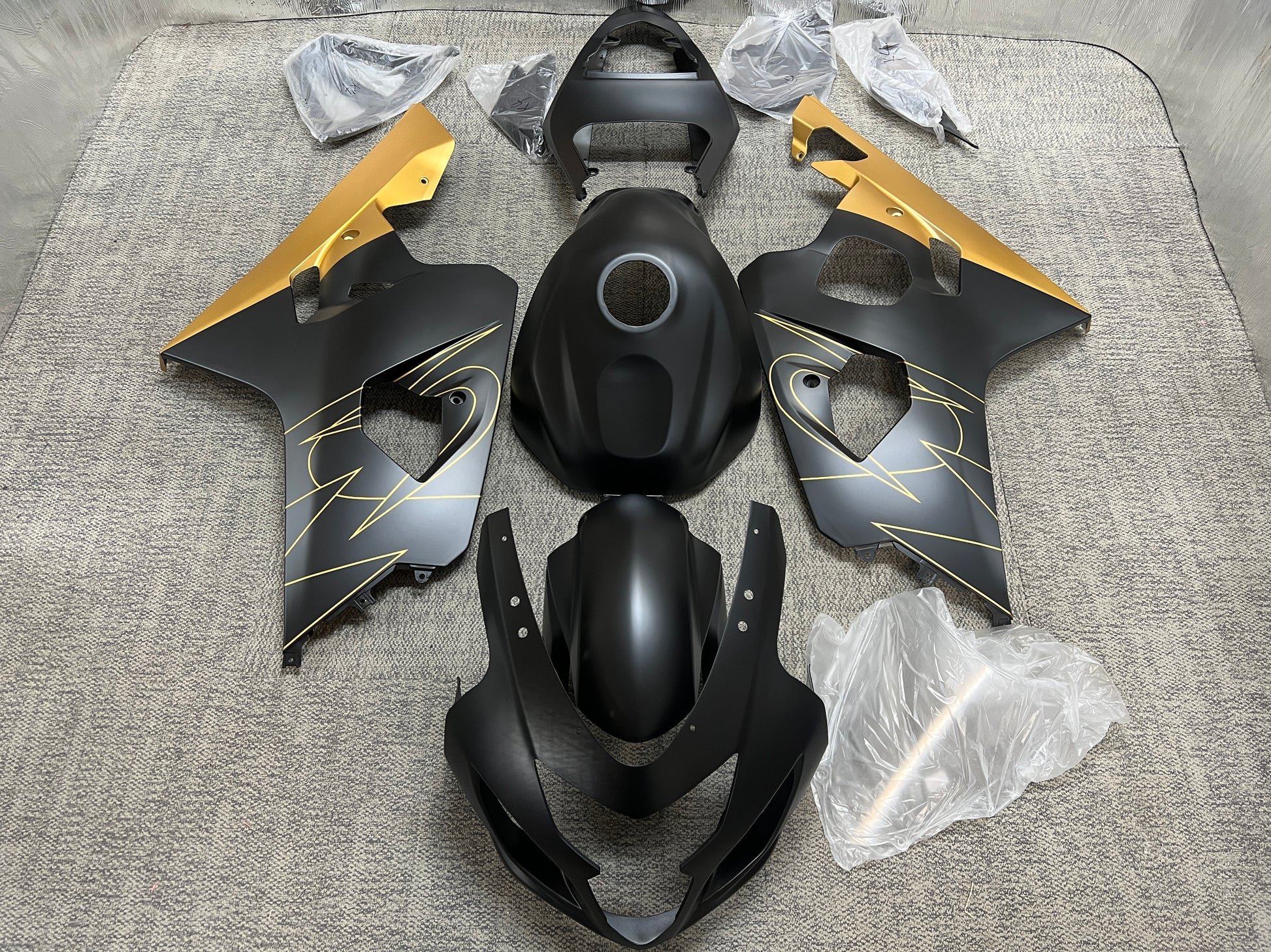 Suzuki GSXR600 Fairings (2004-2005) Flat Black, Gold Tribal at KingsMotorcycleFairings.com