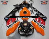 Black, Orange, White and Red Repsol Fairing Kit for a 2004 and 2005 Honda CBR1000RR motorcycle