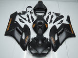 Matte Black and Matte Orange Fairing Kit for a 2004 and 2005 Honda CBR1000RR motorcycle