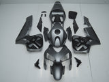 Matte Silver and Black Skull Fairing Kit for a 2003 and 2004 Honda CBR600RR motorcycle