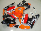 Orange, Red and Black Repsol Fairing Kit for a 2003, 2004 Honda CBR600RR motorcycle.
