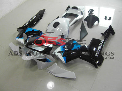 White, Black and Blue Fairing Kit for a 2003, 2004 Honda CBR600RR motorcycle
