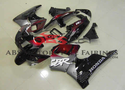 Black, Dark Red and Silver fairing kit for a Honda CBR900RR 1996-1997 motorcycle. Fairings for the Honda CBR900RR 1996-1997 motorcycle are Compressed Molded and modifications to the fairings may be required at time of installation