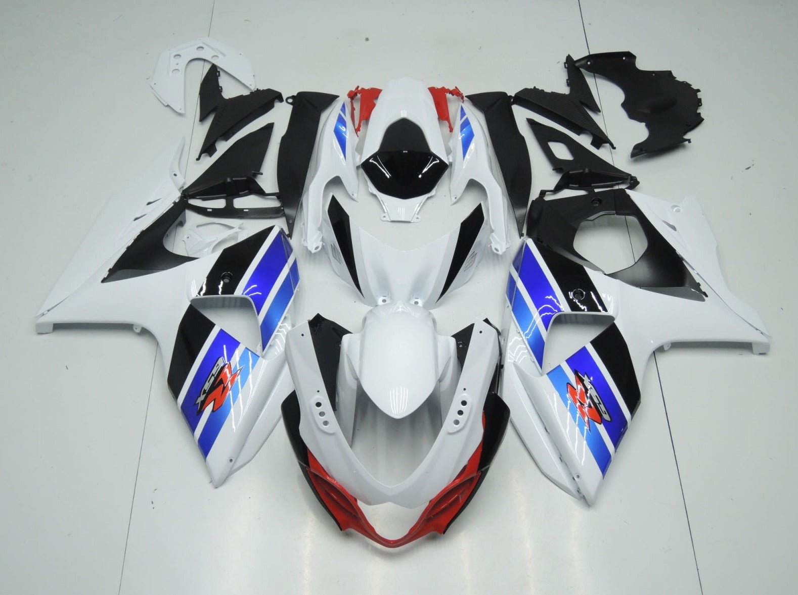 White, Black, Blue and Red Fairing Kit for a 2009, 2010, 2011, 2012, 2013, 2014, 2015 & 2016 Suzuki GSX-R1000 motorcycle