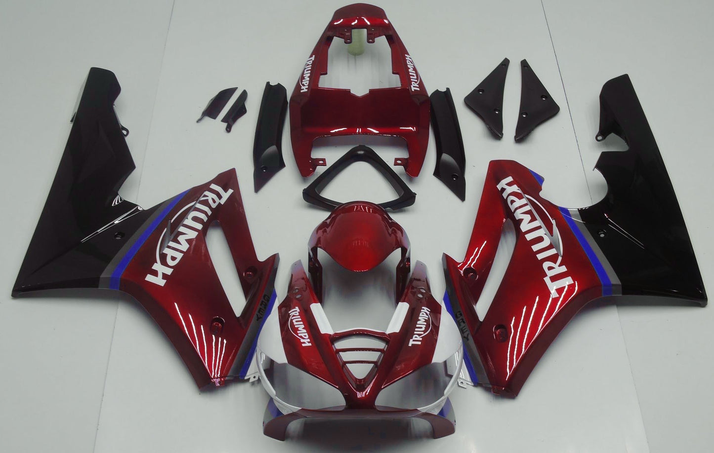Candy Red, Black, White, Blue and Gray Fairing Kit for a 2009, 2010, 2011 & 2012 Triumph Daytona 675 motorcycle