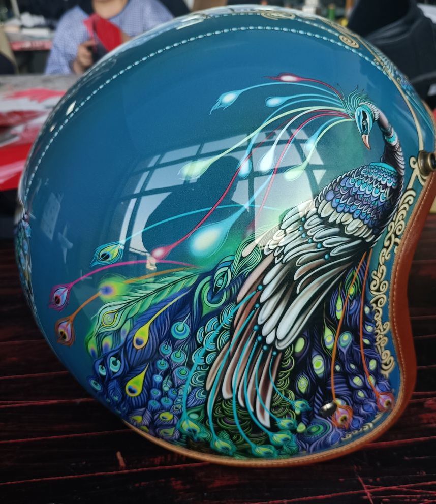 Hand Painted Peacock Motorcycle Helmet is brought to you by KingsMotorcycleFairings.com