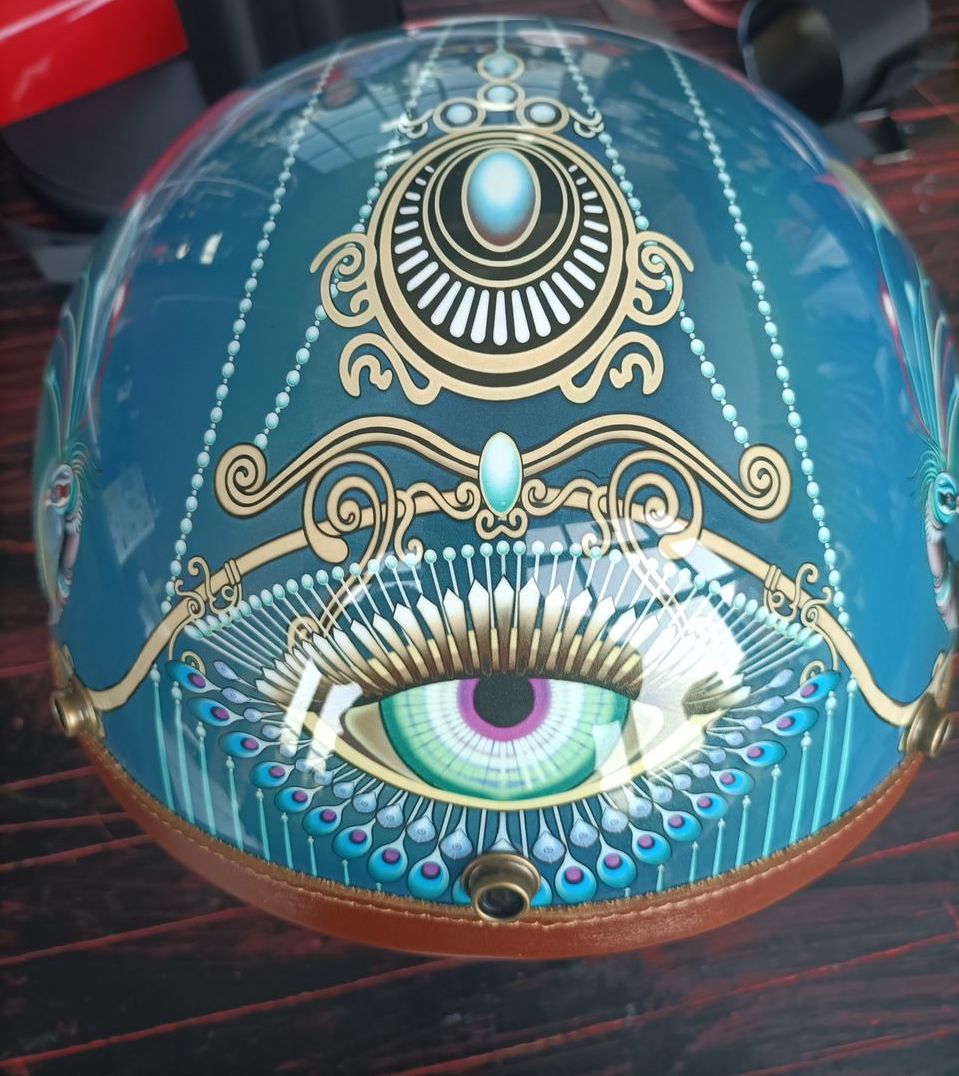 Hand Painted Peacock Motorcycle Helmet is brought to you by KingsMotorcycleFairings.com