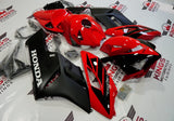 Black and Red Fairing Kit for a 2004 & 2005 Honda CBR1000RR motorcycle.